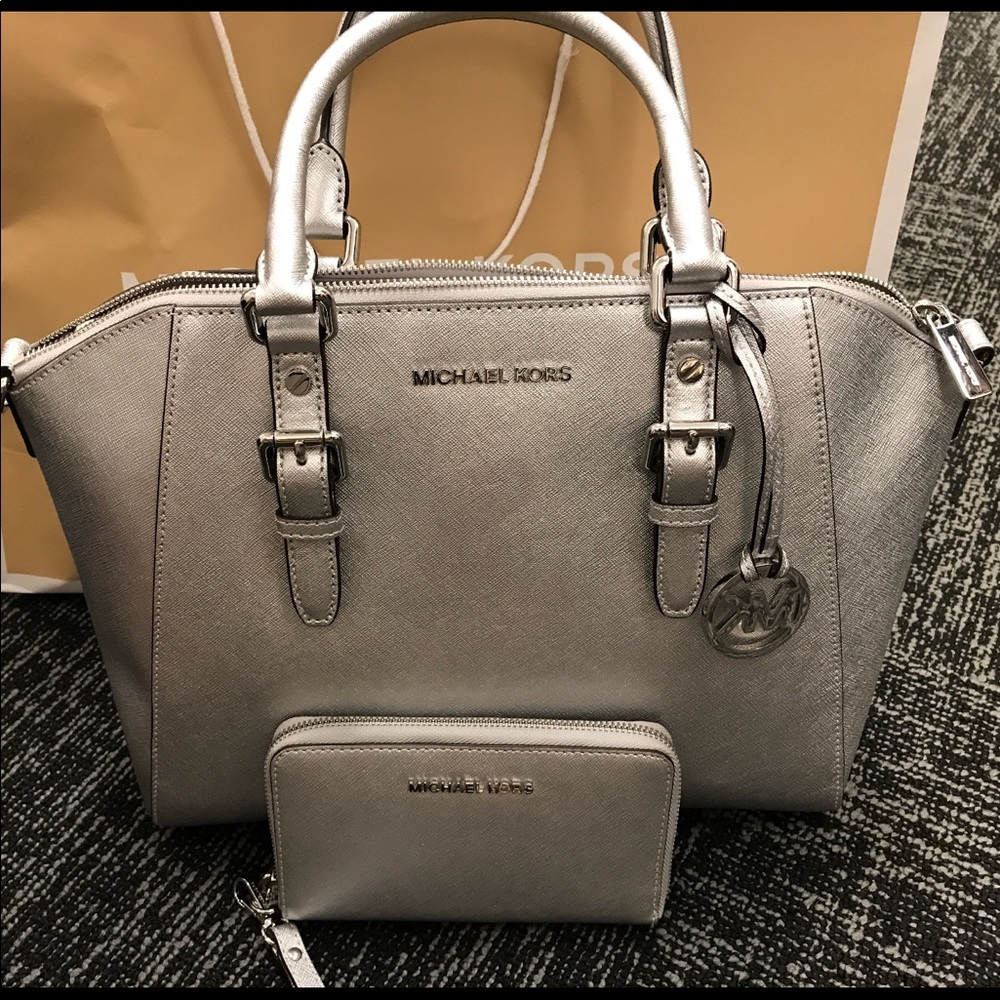 Micheal Kors Authentic Silver Purse and wristlet